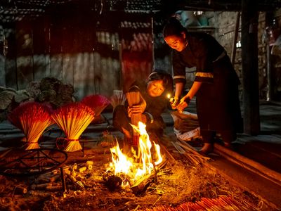 Incense smoke drifting in a quiet dimly lit room